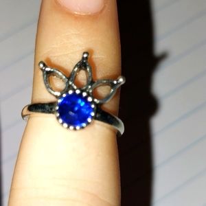 Silver ring with dark blue set